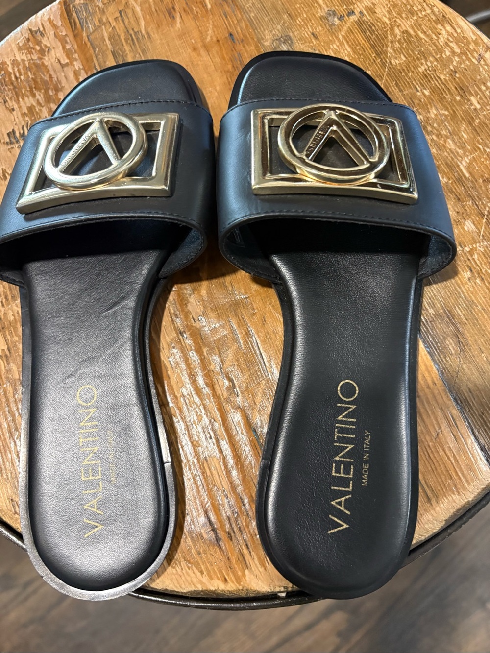 Valentino Black Leather Slide Mules with Gold Emblem